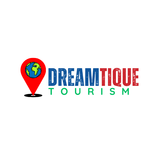 Dreamtique Tourism logo with a globe inside a red location pin, representing global travel experiences and tourism services for UAE and GCC countries